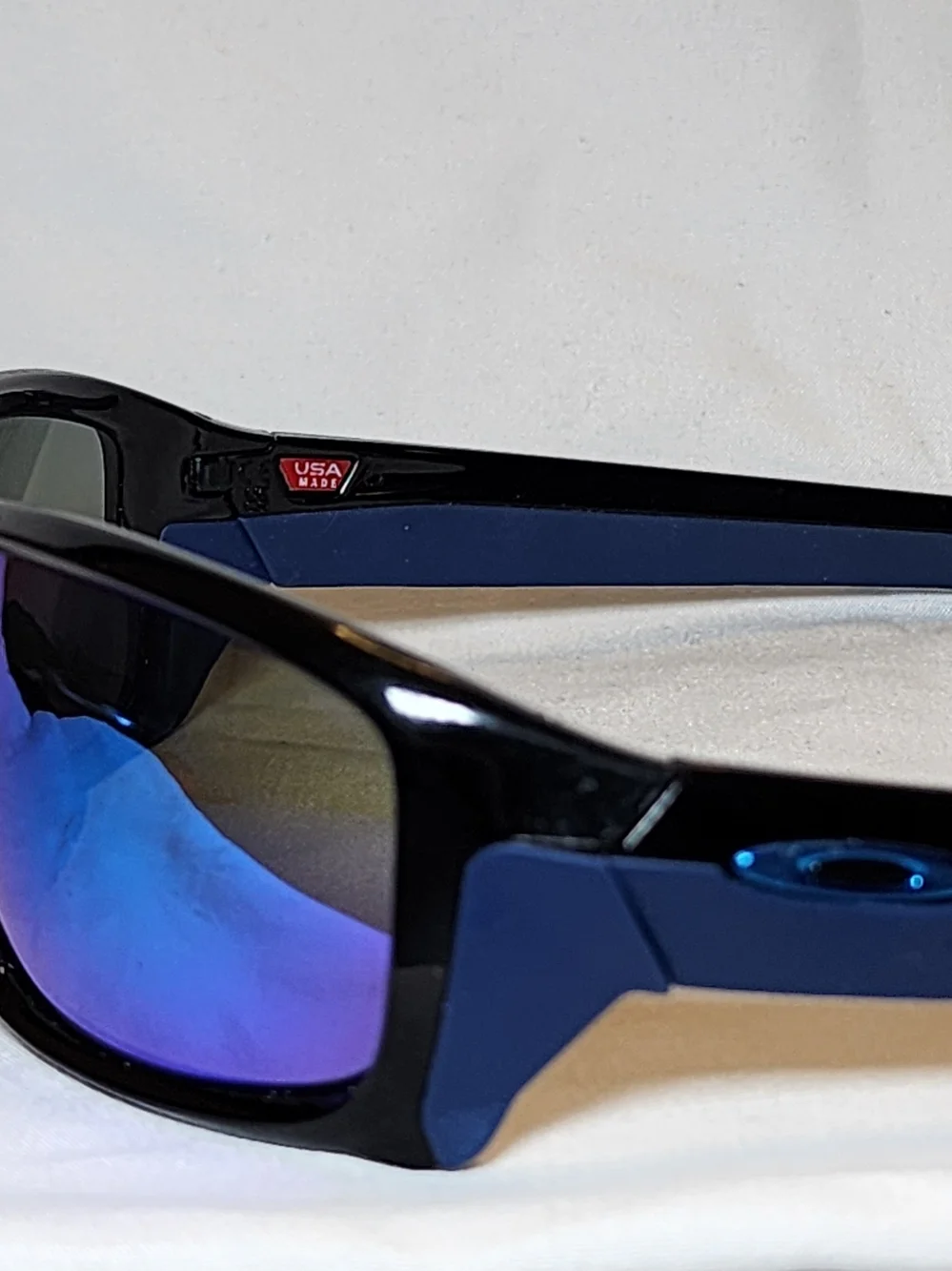 Oakley Black Sunglasses with Blue-Purple Mirrored Lenses